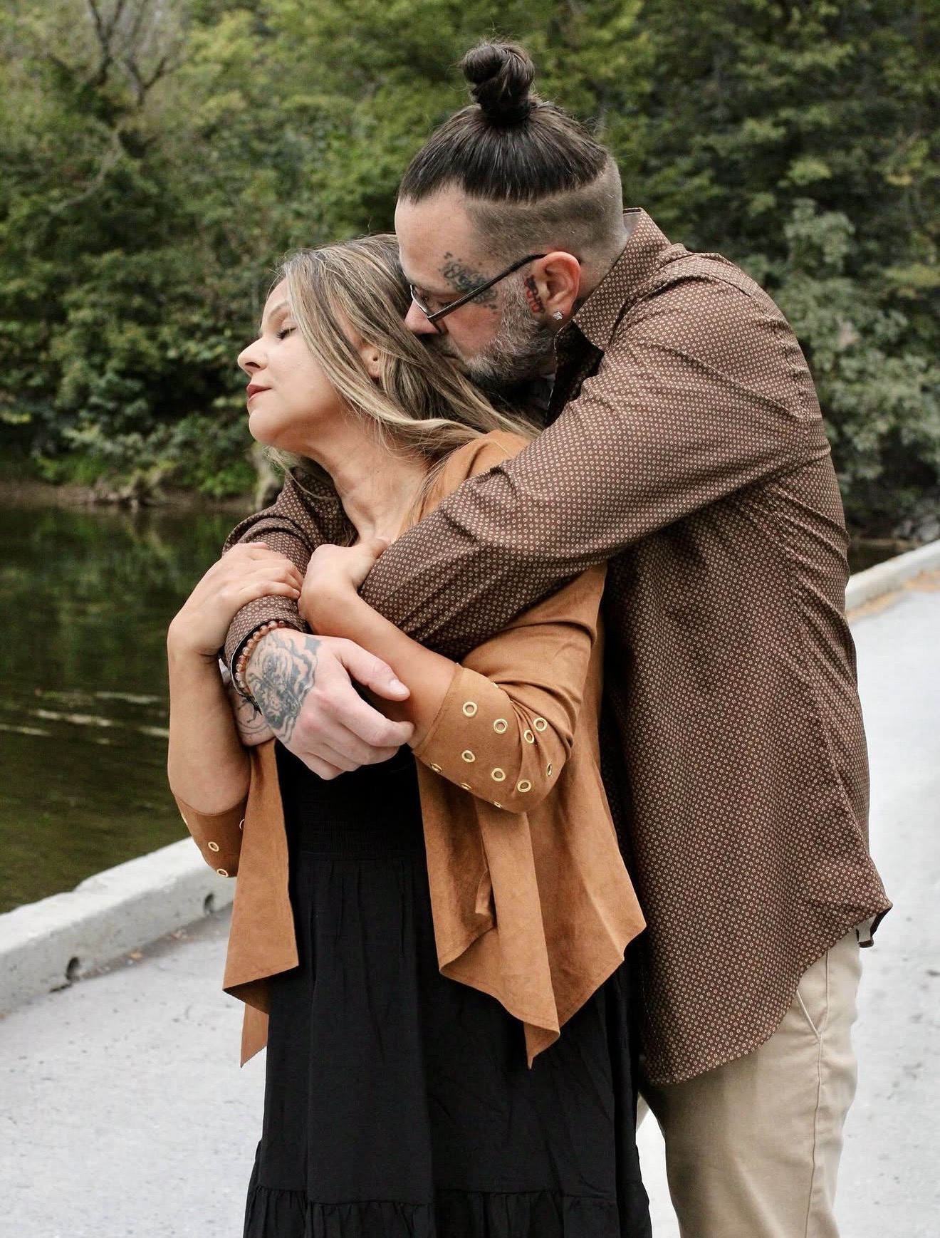 Couple embracing beside the river