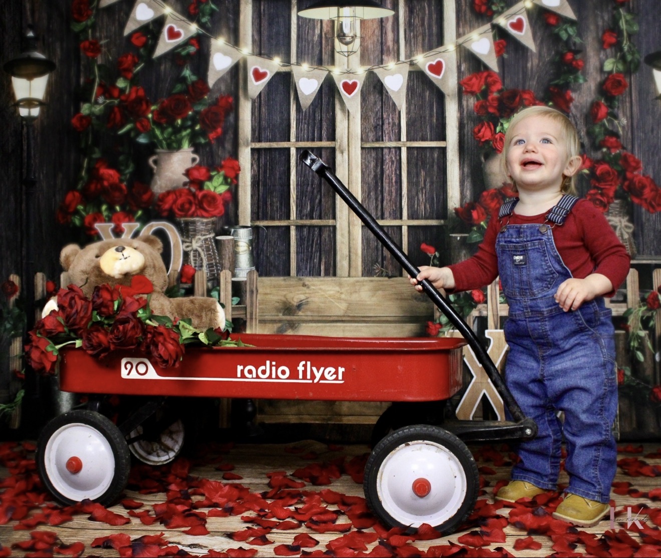 Toddler in a Christmas wagon portrait